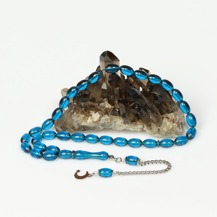 Gök Mavisi Çelik Püsküllü Sıkma Kehribar Tesbih (7*11 mm)