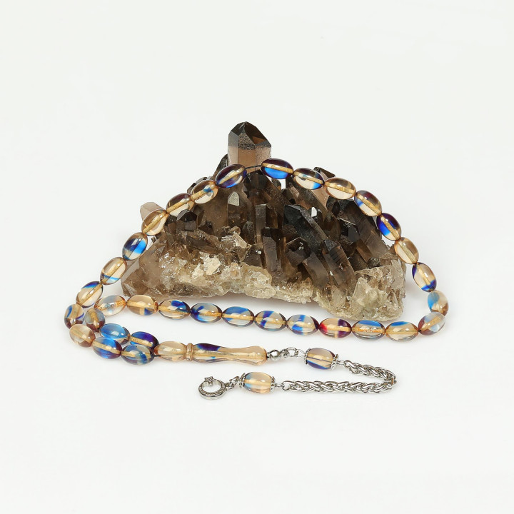 Kırık Beyaz Mavi Hareli Çelik Püsküllü Sıkma Kehribar Tesbih (7*11 mm)