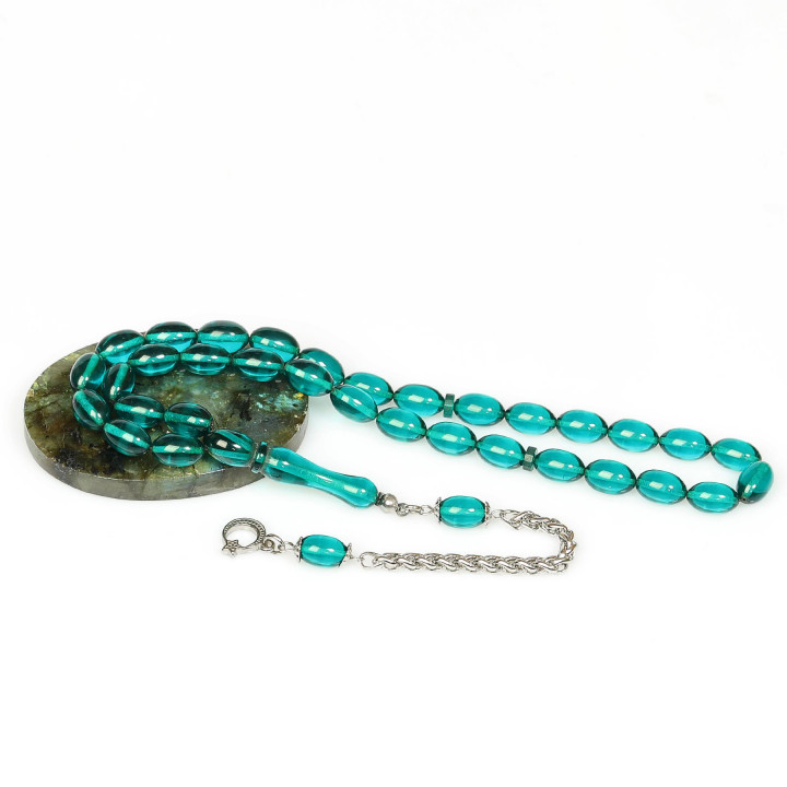 Turkuaz Esintili Çelik Püsküllü Sıkma Kehribar Tesbih (7*11 mm)