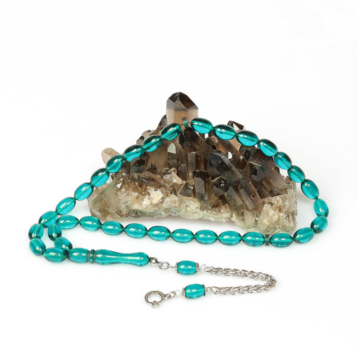 Turkuaz Esintili Çelik Püsküllü Sıkma Kehribar Tesbih (7*11 mm)